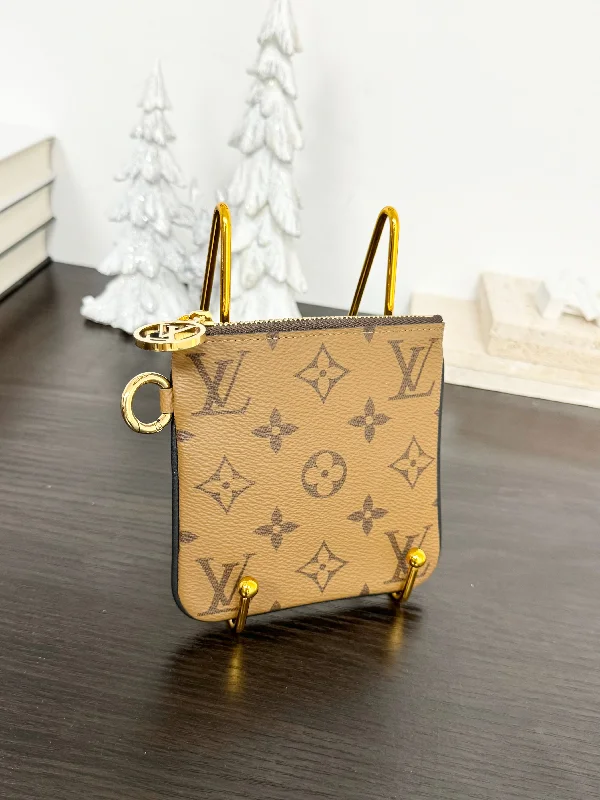 Ladies Louis Vuitton Petite Malle bags with a star - shaped charm for cutenessLOUIS VUITTON 2020 Monogram Reverse Square Pouch