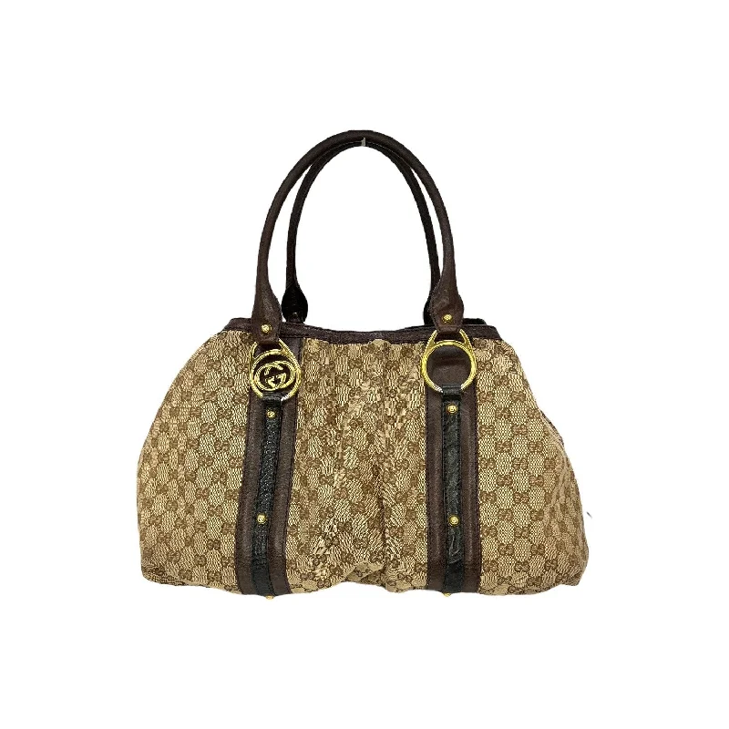 Women Gucci bags with a magnetic snap closure for easy accessGucci GG Canvas Interlocking Icon Tote