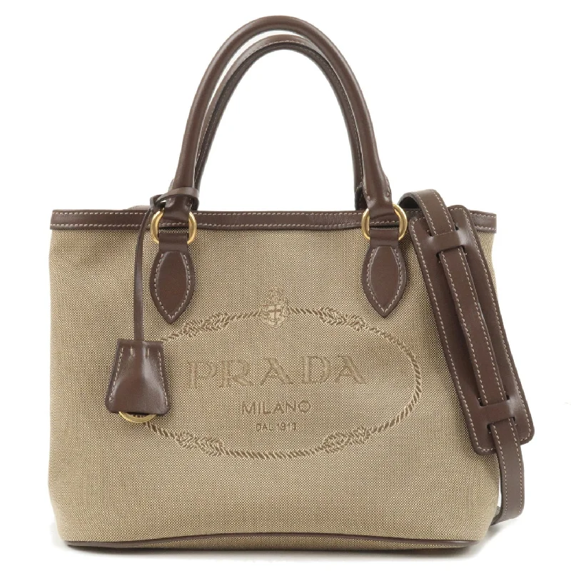 Ladies Prada Galleria bags with a detachable shoulder strapPrada Logo Jacquard Beige Canvas Leather Trim Crossbody Satchel Bag