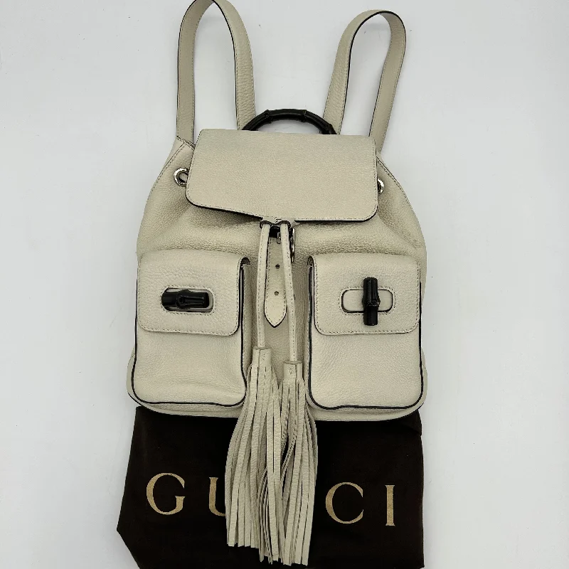 Ladies Gucci handbags with a detachable coin purse insideGucci Leather Bamboo Tassel Backpack White