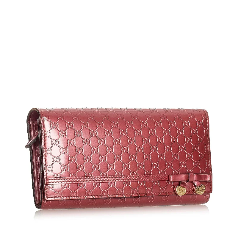 Women Gucci Sylvie bags with a monogram - embossed leatherGucci Microguccissima Patent Leather Long Wallet (SHG-22201)