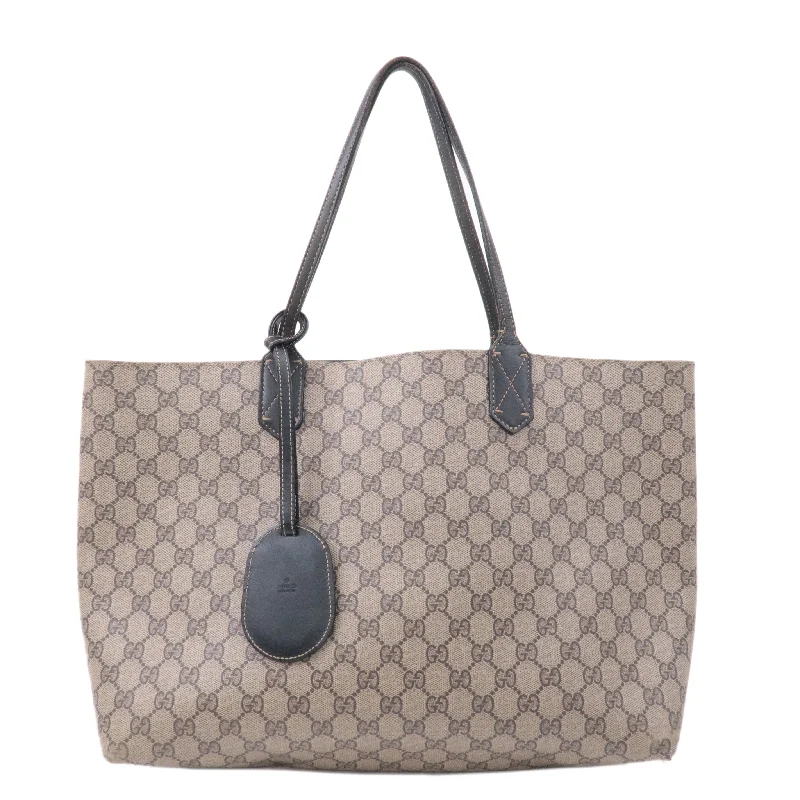 Women Gucci bags with a front - zip pocket for small itemsGucci GG Supreme Leather Reversible Tote Bag 368568