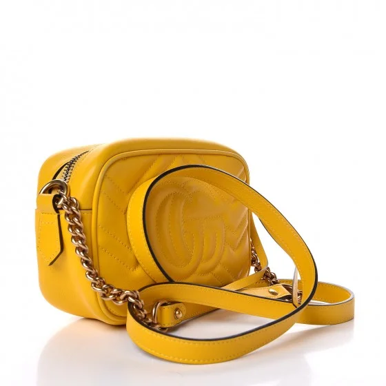 Women Gucci bags with a snap - button closure and a decorative charmGUCCI Calfskin Matelasse Mini GG Marmont  Shoulder Bag Yellow