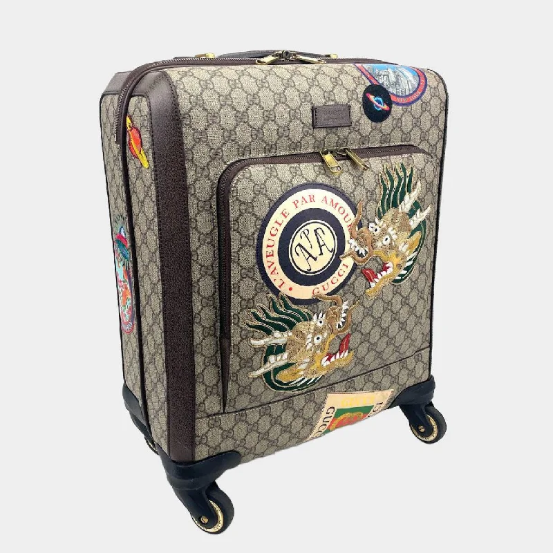 Gucci handbags for women with a beaded trimGUCCI GG Supreme Carry-On Suitcase- Travel Patches