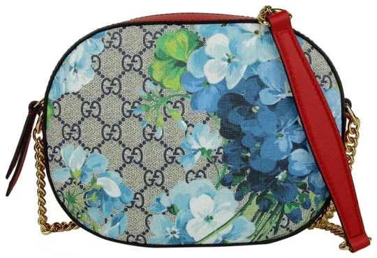 Gucci backpacks for women with a padded laptop compartmentGucci GG Supreme Monogram Blooms Crossbody